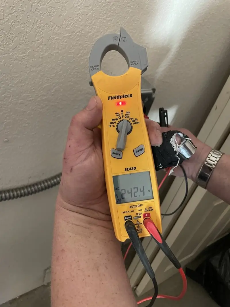 Voltage testing with clamp meter during Generator Installation in Allendale